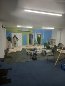 Image showing painting and decorating students at work painting the Doncaster Scout Hut. 